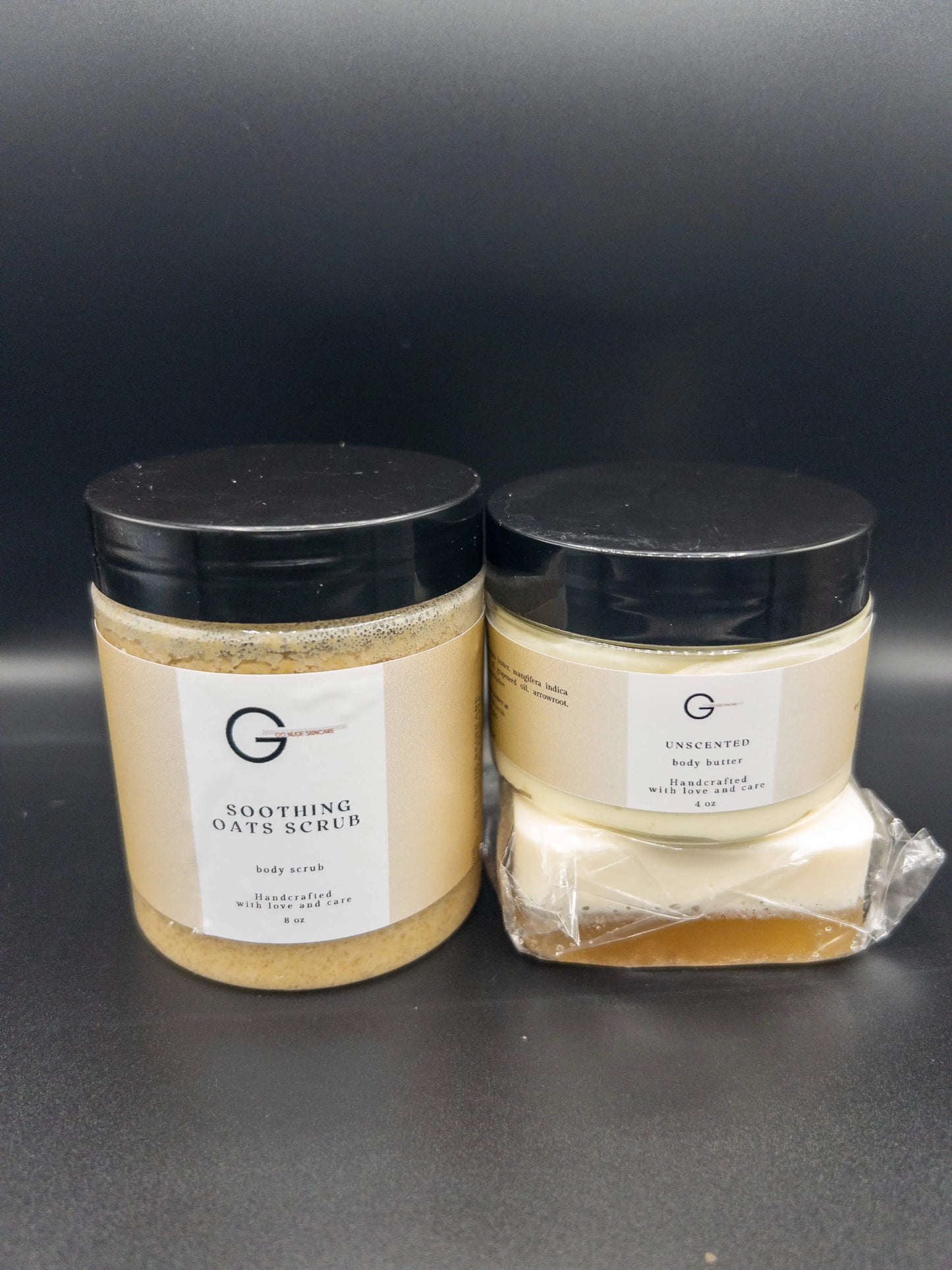 Picture of a 8 ounce jar of oatmeal body scrub with a 4 oz bar of turmeric and honey soap, and a 4 oz jar of unscented shea body butter. Set is a natural eczema treatment and atopic dermatitis cream.